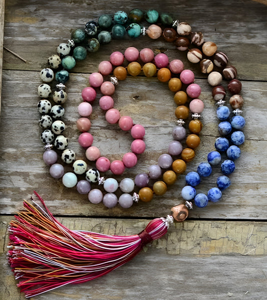 Japa mala beads for meditation with 108 multicolored gemstones, 7 chakras, red tassel