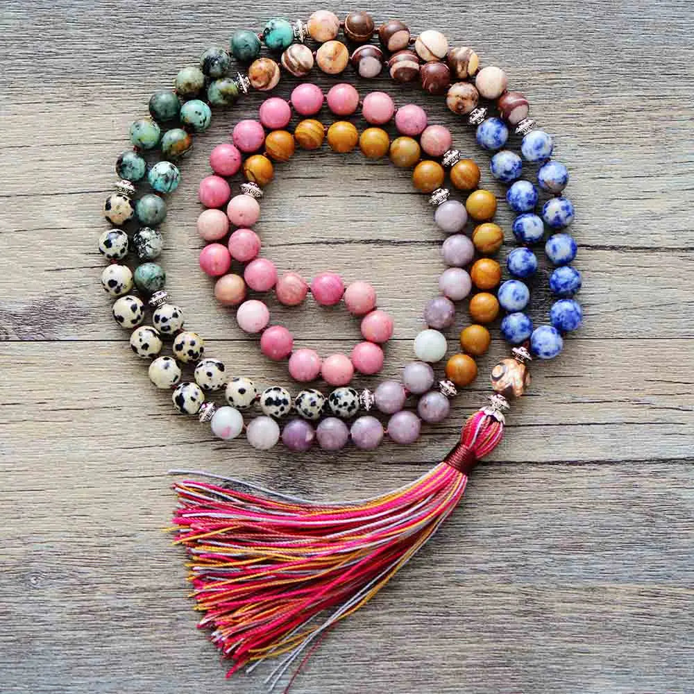 Colorful beaded necklace with a tassel on a wooden surface