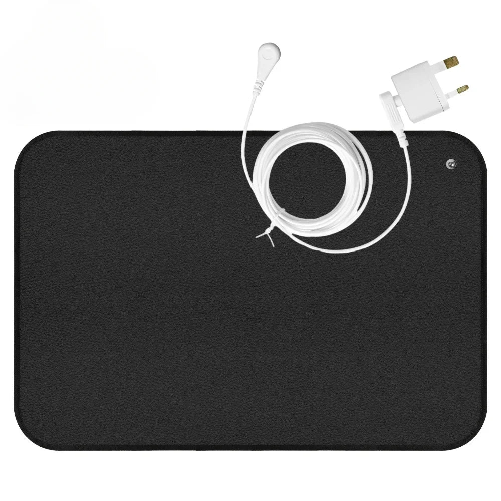 Conductive grounding mat with non-slip backing and grounding cord
